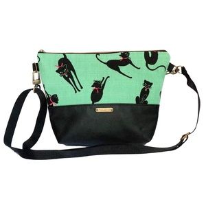 Small handcrafted lightweight zippered convertible handbag